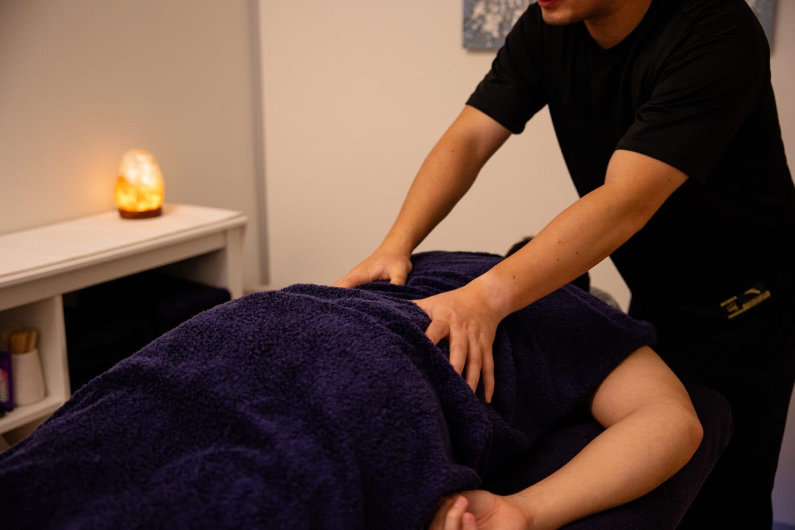Massage therapist treating a client at Lakeside Wellness